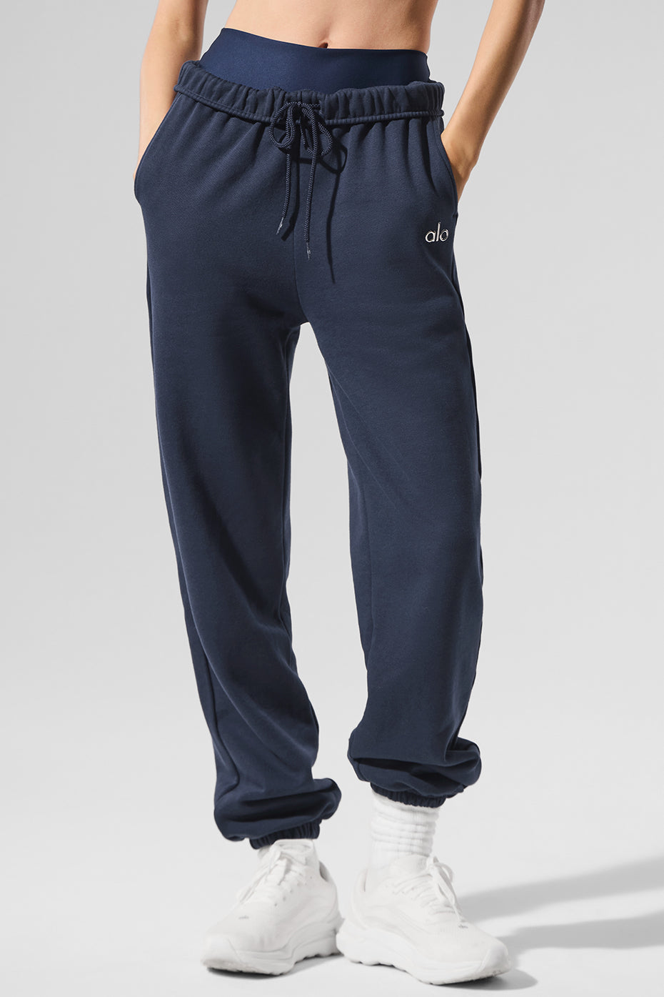 Model wearing navy sweatpants paired with casual hoodie for a laid-back look