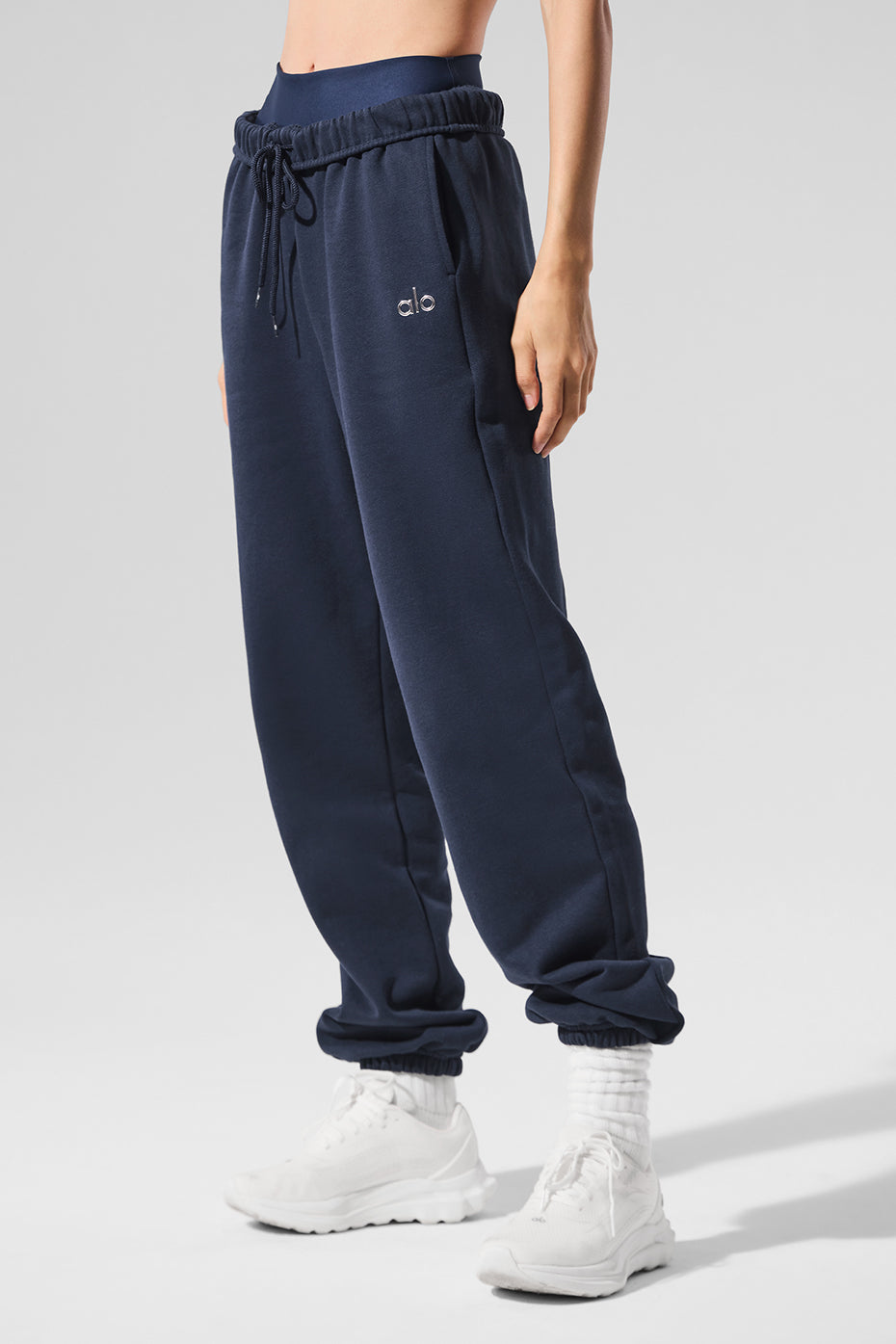 Model wearing navy sweatpants paired with casual hoodie for a laid-back look