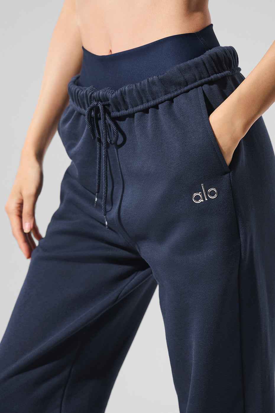 Close-up of the soft French terry fabric of navy blue sweatpants