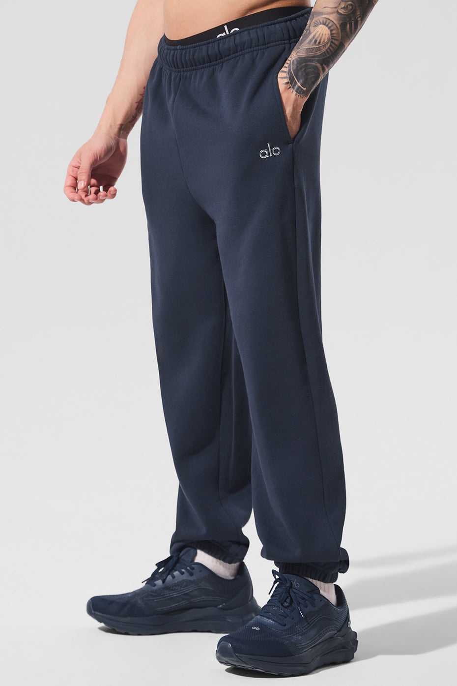 Front view of navy joggers showcasing relaxed fit and elastic waistband.