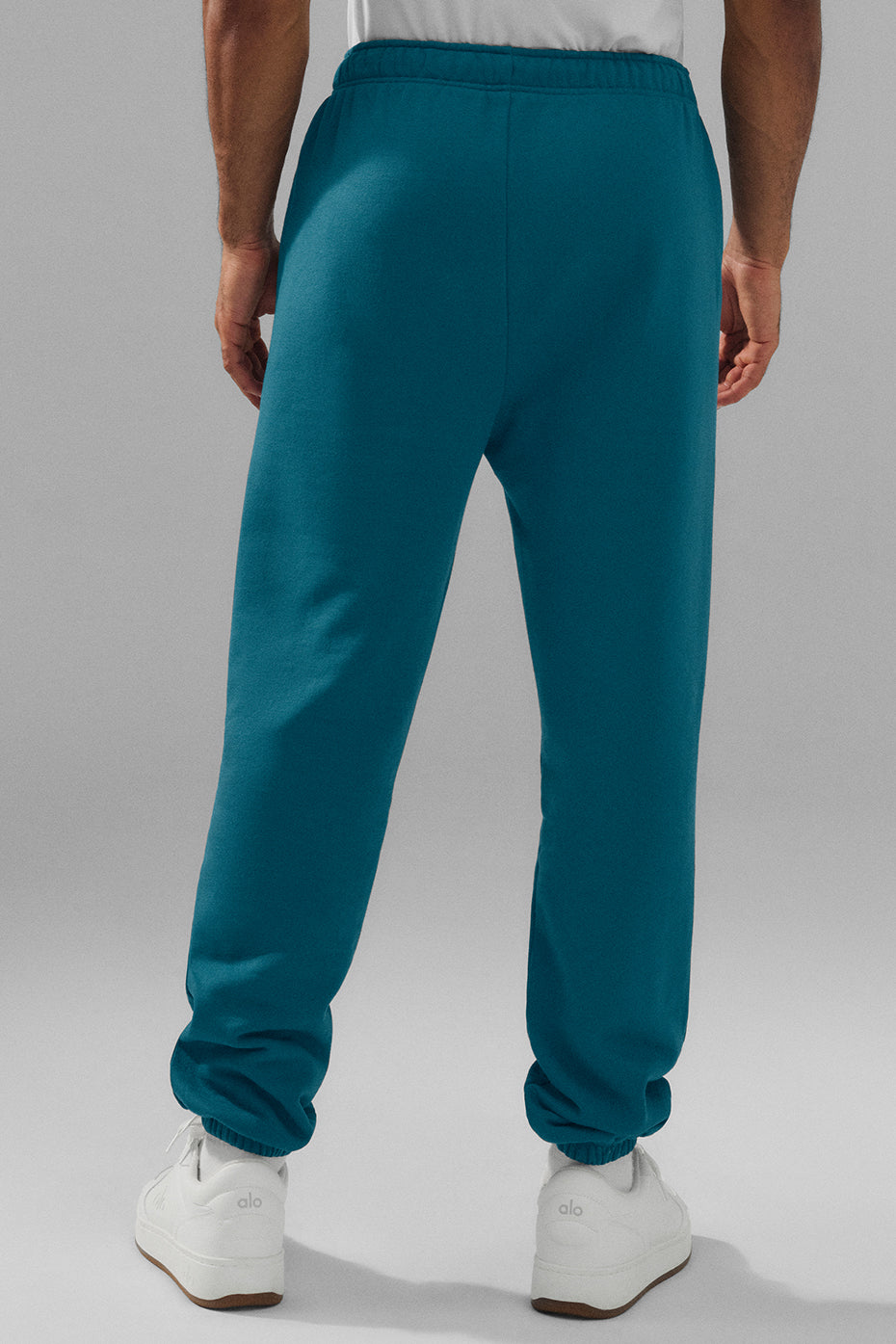 Side view of baggy sweatpants in Oceanic Teal, ideal for casual wear.
