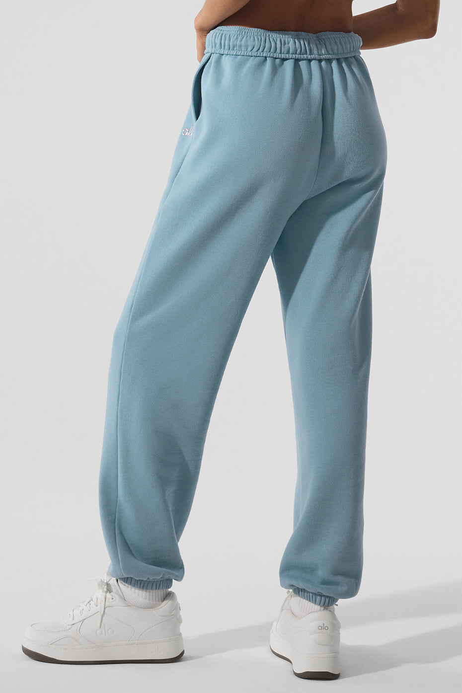 Side view of relaxed fit camo sweatpants, showcasing elastic waist and cuffs.