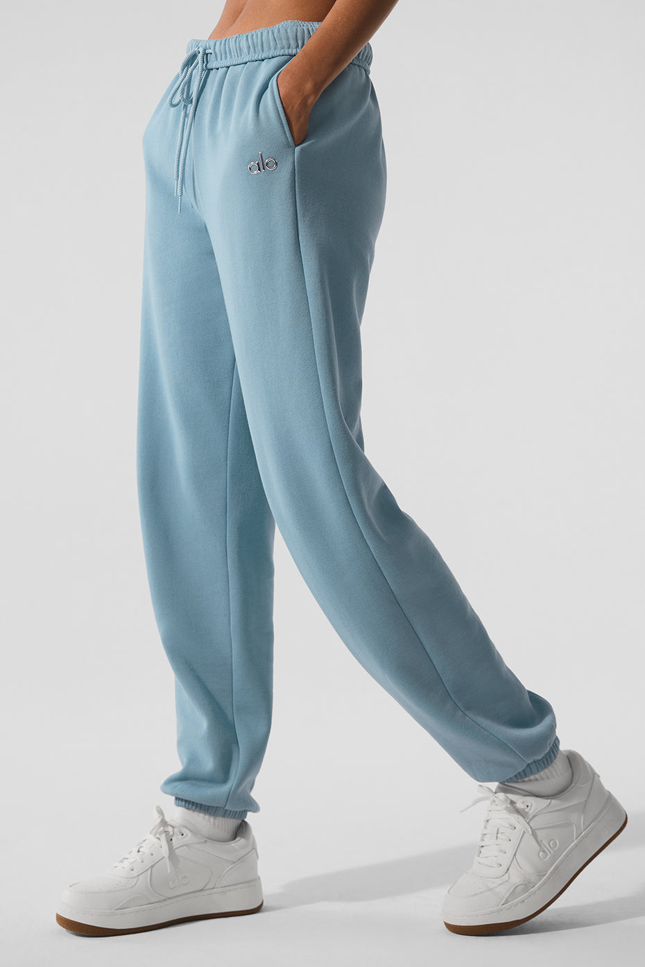 Side view of relaxed fit camo sweatpants, showcasing elastic waist and cuffs.