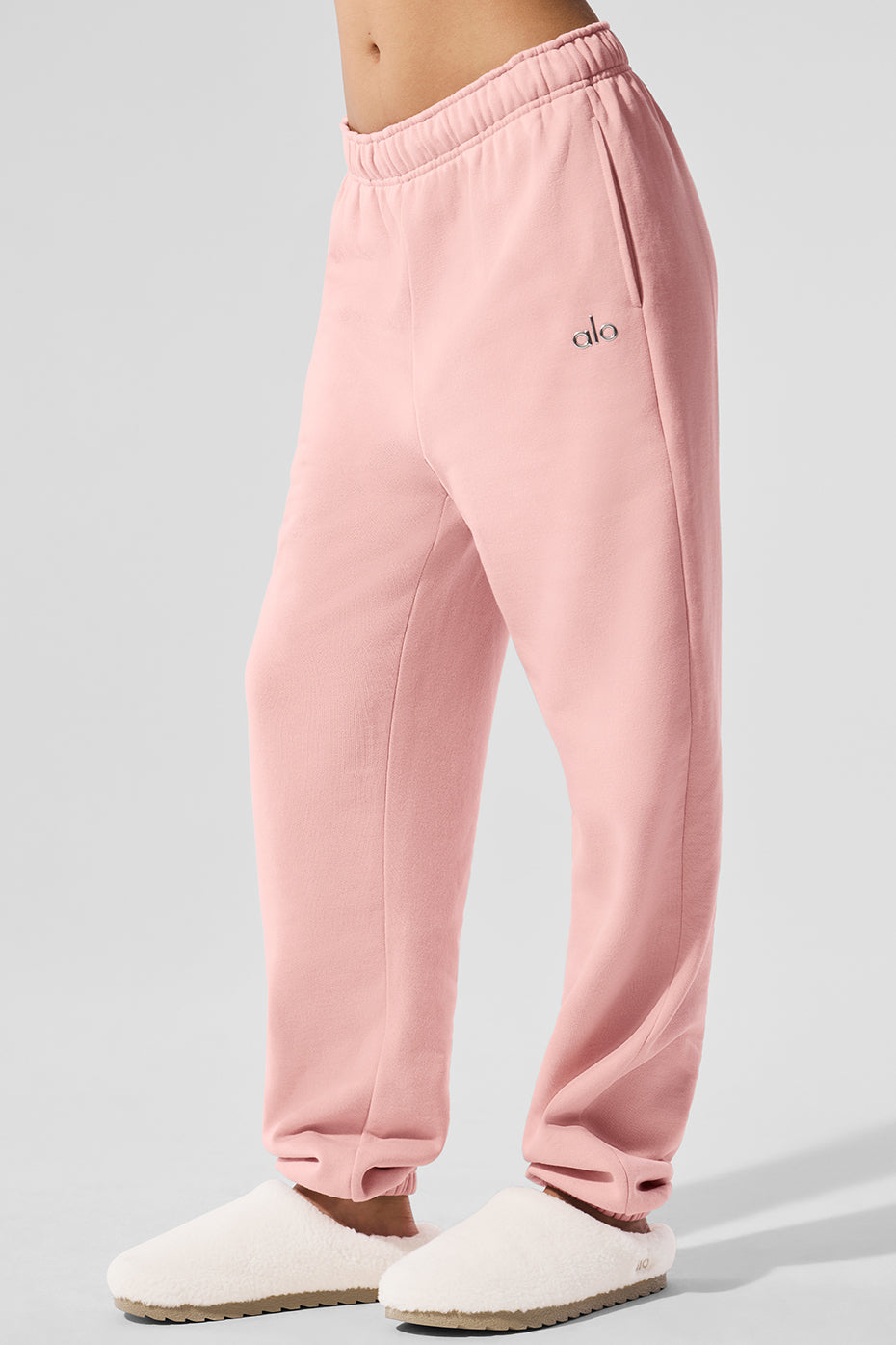 Back view showcasing elastic waistband on black sweatpants