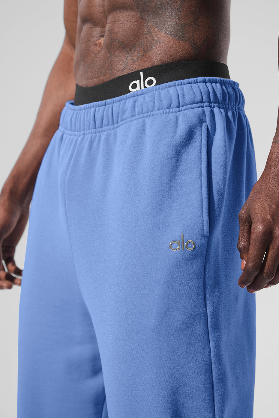 Flat lay of grey sweatpants and matching top, ideal for lounge or streetwear
