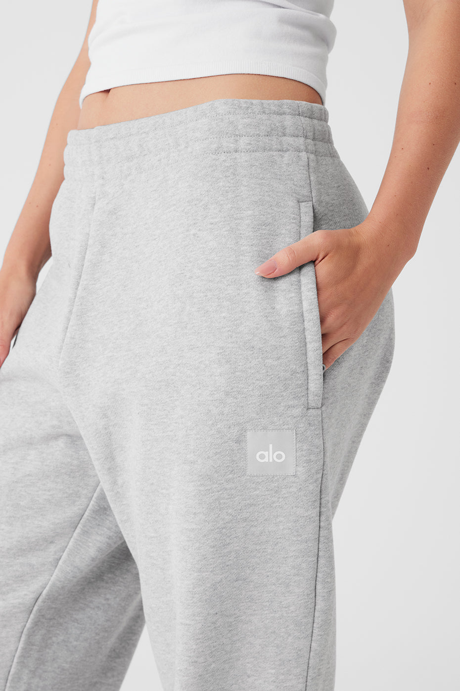 Black sweatpants draped on a wooden bench for urban style