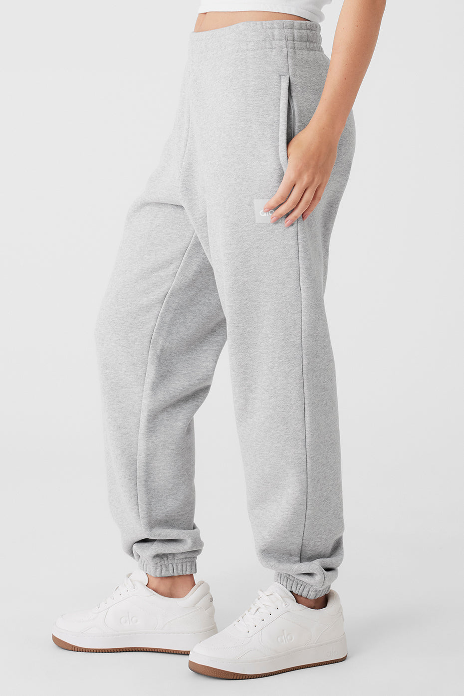 Model wearing camo sweatpants with oversized fit in street setting