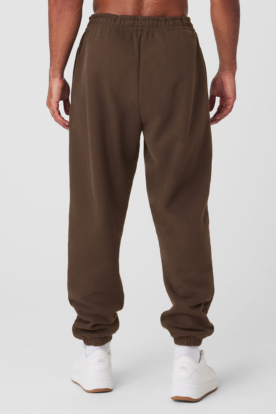 Espresso-colored wide leg sweatpants styled with a neutral hoodie