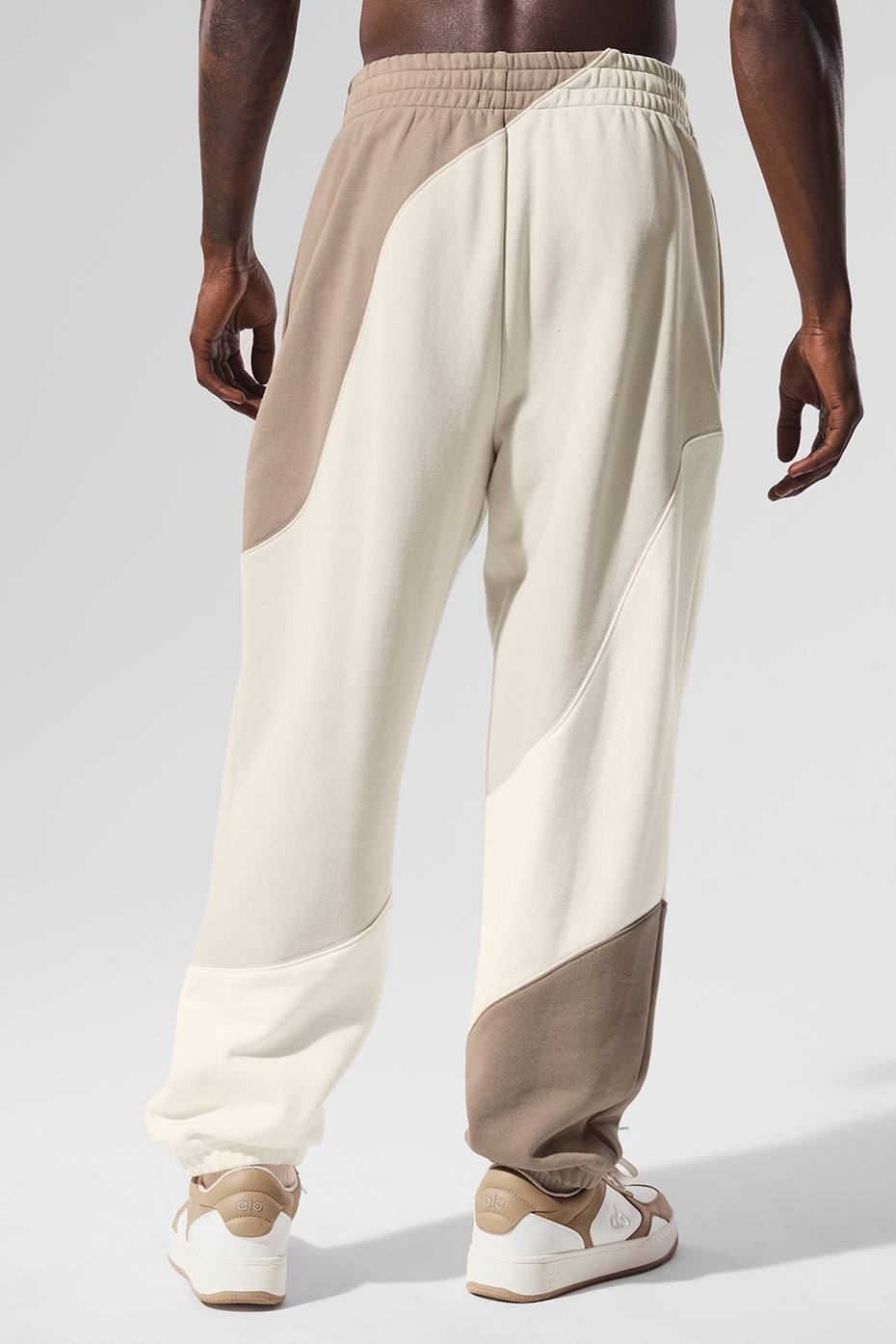 Model posing in relaxed-fit wide-leg sweatpants