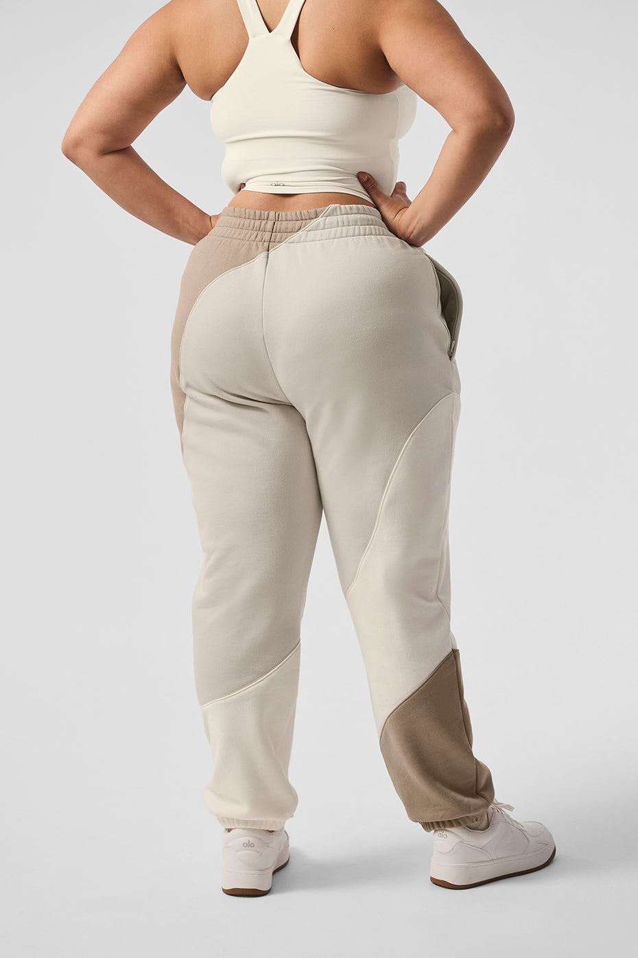 Model wearing ivory wave stitch sweatpants with oversized hoodie