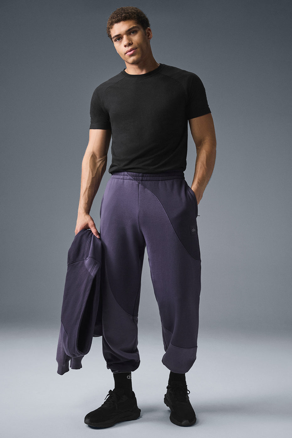 Side profile of petite sweatpants for women showcasing stitched wave detail.