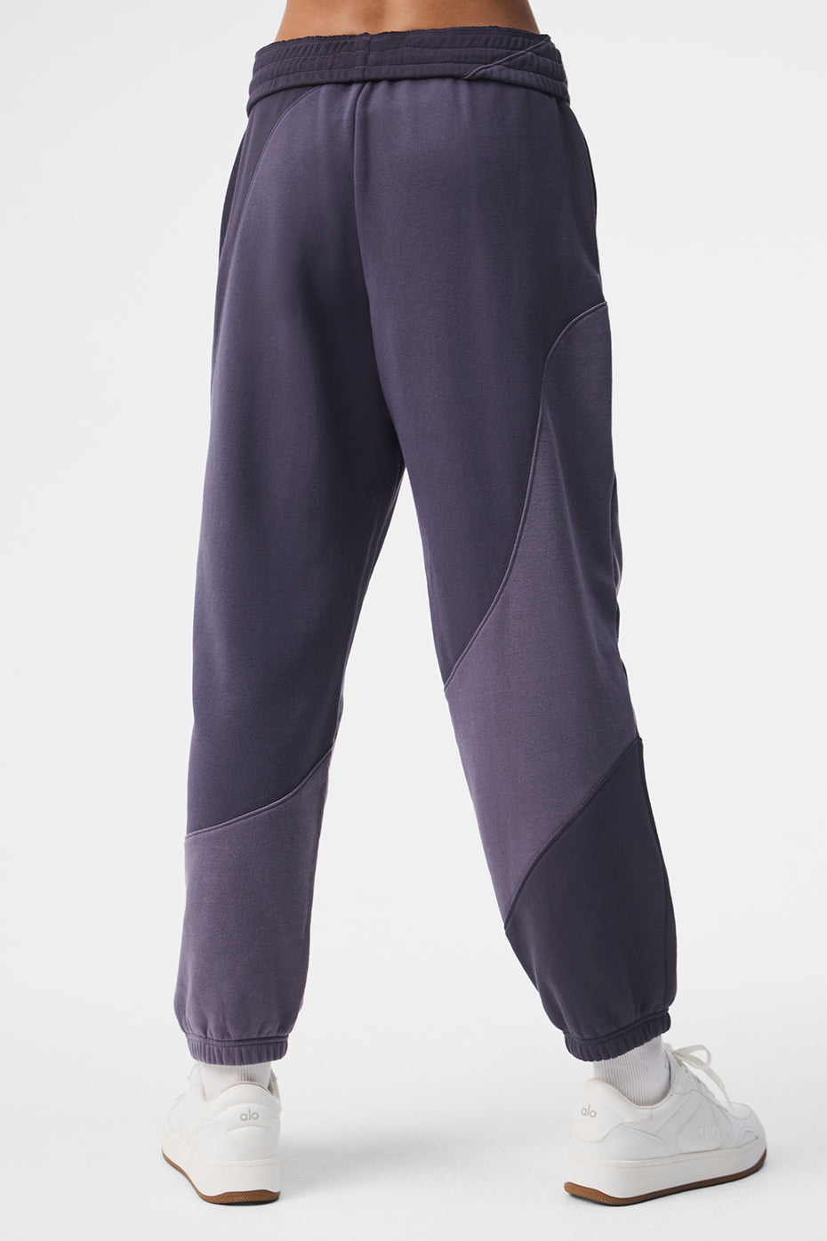 Side view of baggy sweatpants paired with a cropped top, ideal for athleisure wear.