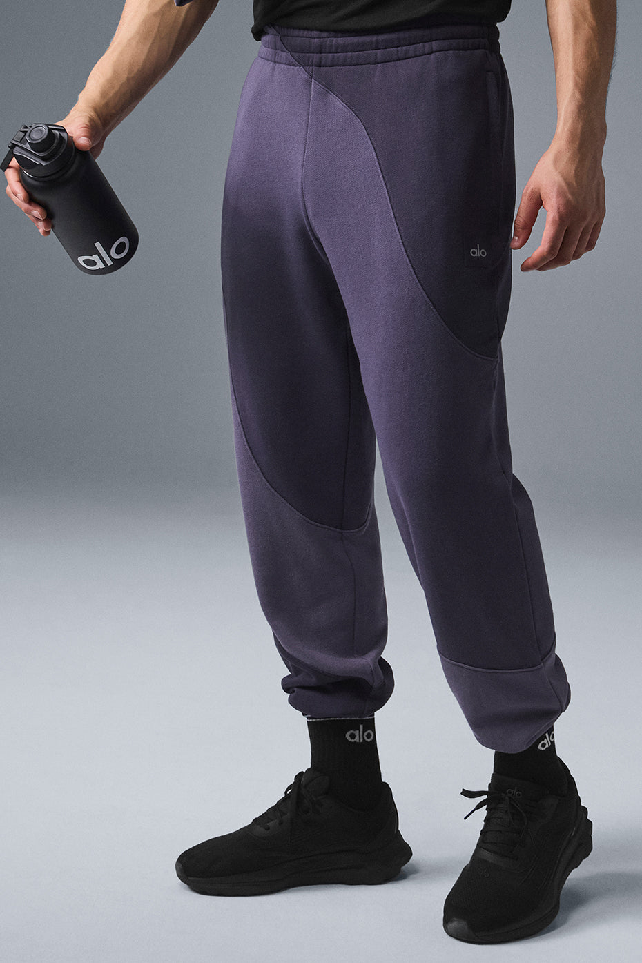 Side profile of petite sweatpants for women showcasing stitched wave detail.