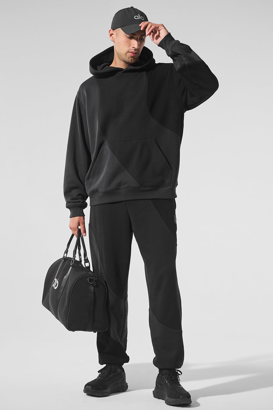 Close-up of the elastic waistband on vintage black sweatpants for a snug fit.