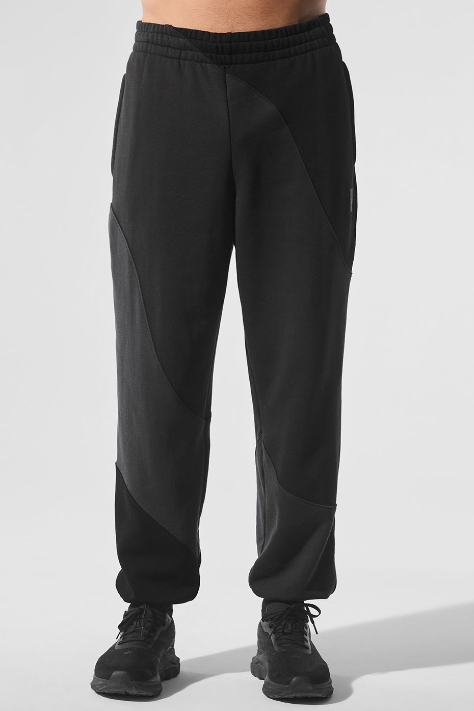 Front view of Swagger Wave Vintage Black Sweatpants showcasing the unique wave pattern.
