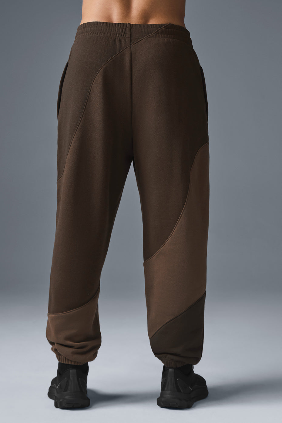 Close-up of elastic waistband and cuffs on relaxed-fit sweatpants, styled for casual outings