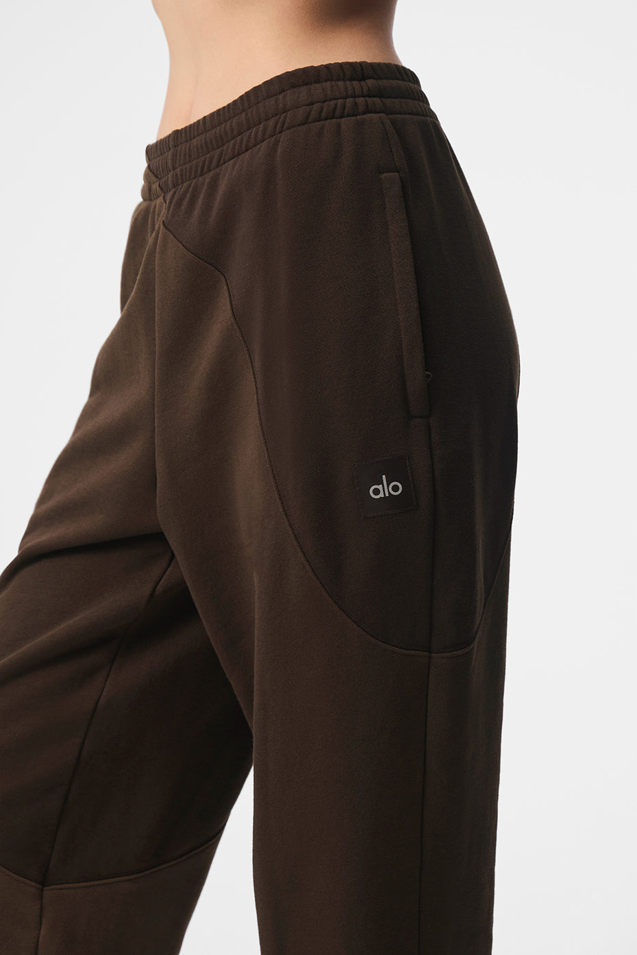 Folded waistband espresso sweatpants paired with black hoodie for women