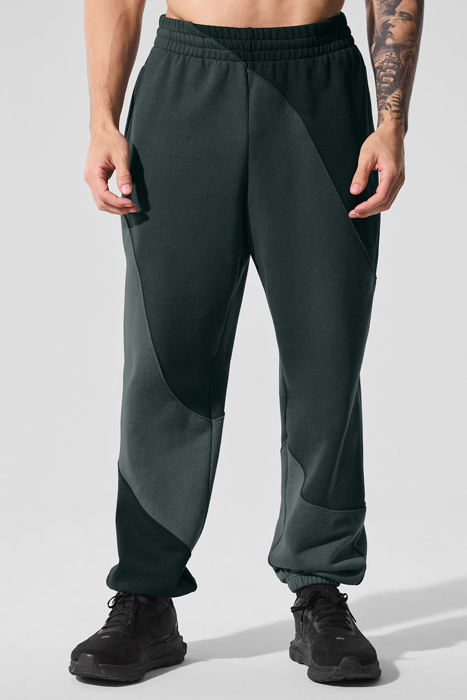 Side view of baggy sweatpants showing wave seam and relaxed fit
