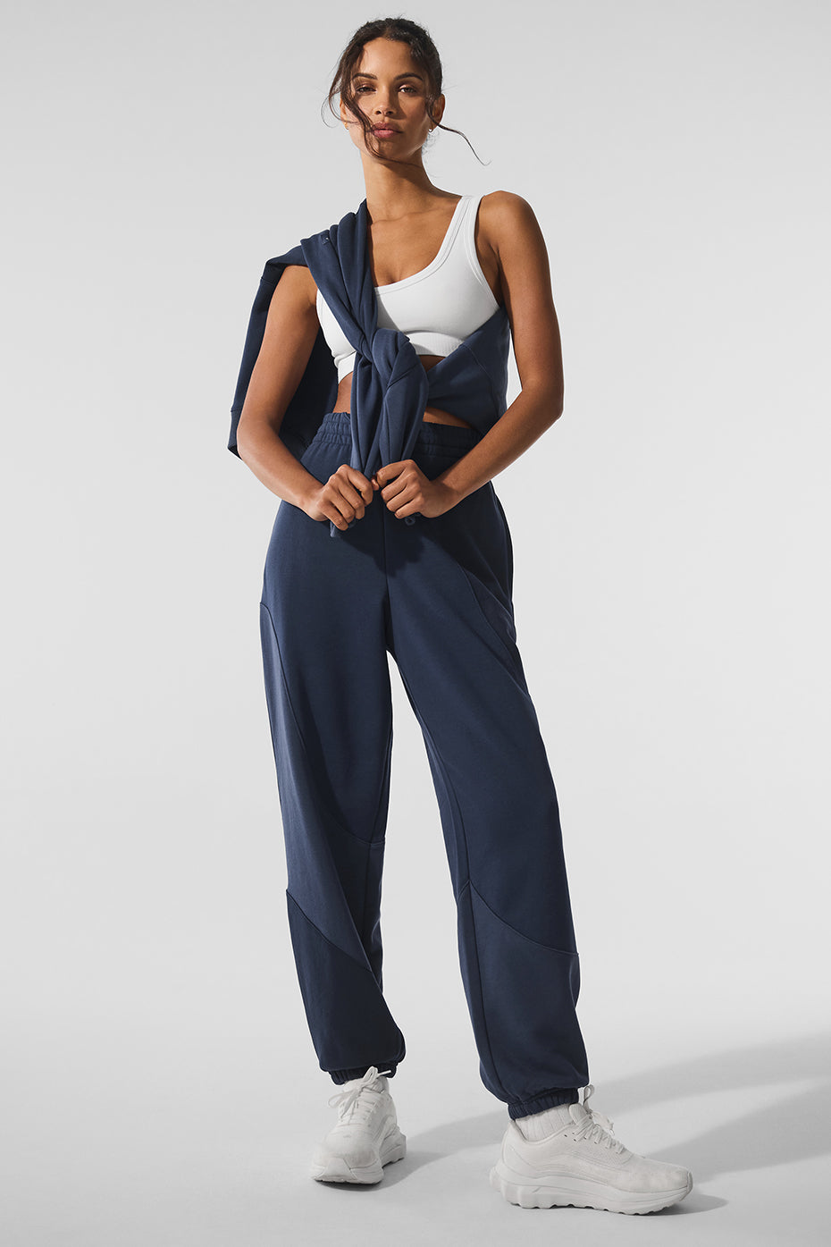 Front view of navy unisex sweatpants with wave design