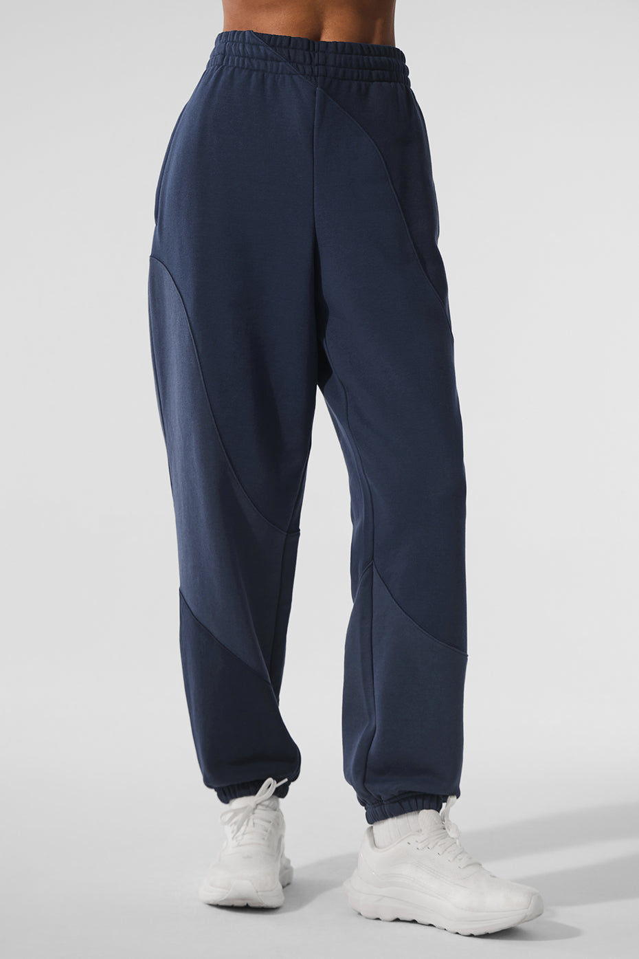 Side view showcasing the relaxed fit of the sweatpants
