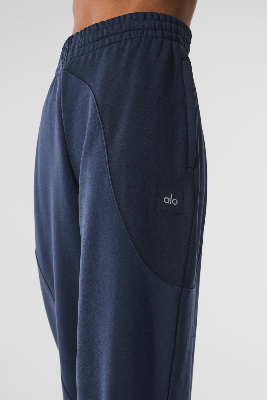 Side view showcasing the relaxed fit of the sweatpants