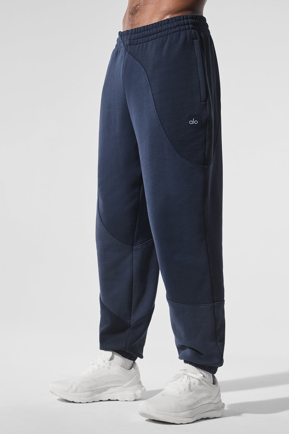 Comfortable navy sweatpants paired with a matching hoodie.