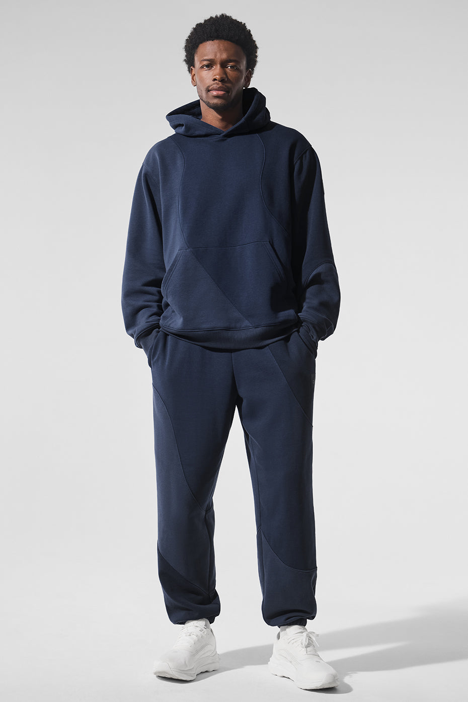 Navy Wave Comfort Sweatpants in a stylish lounge setting.