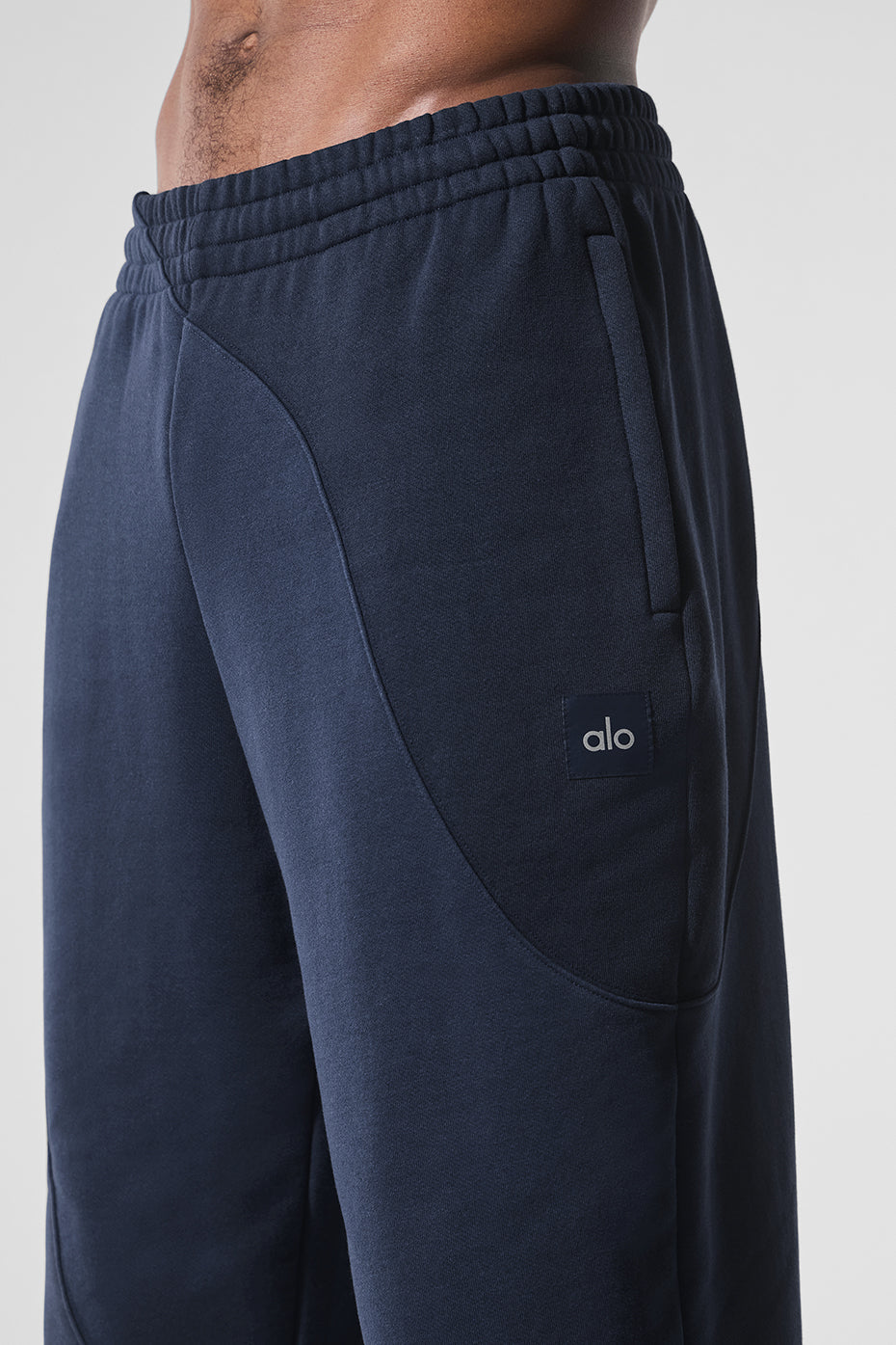 Navy Wave Comfort Sweatpants in a stylish lounge setting.