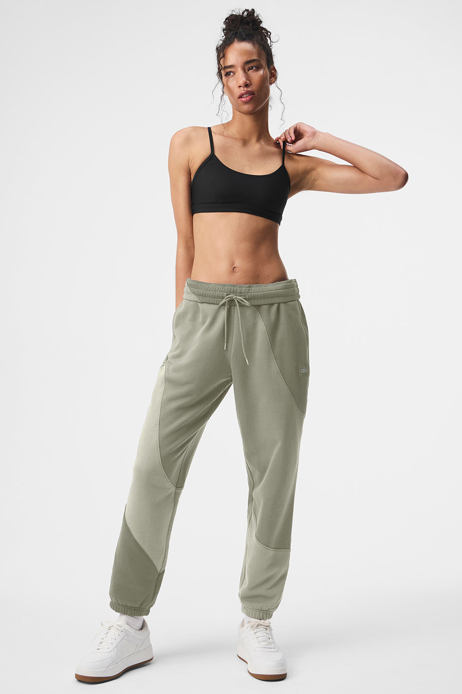 Close-up of wave-pattern stitching on grey sweatpants