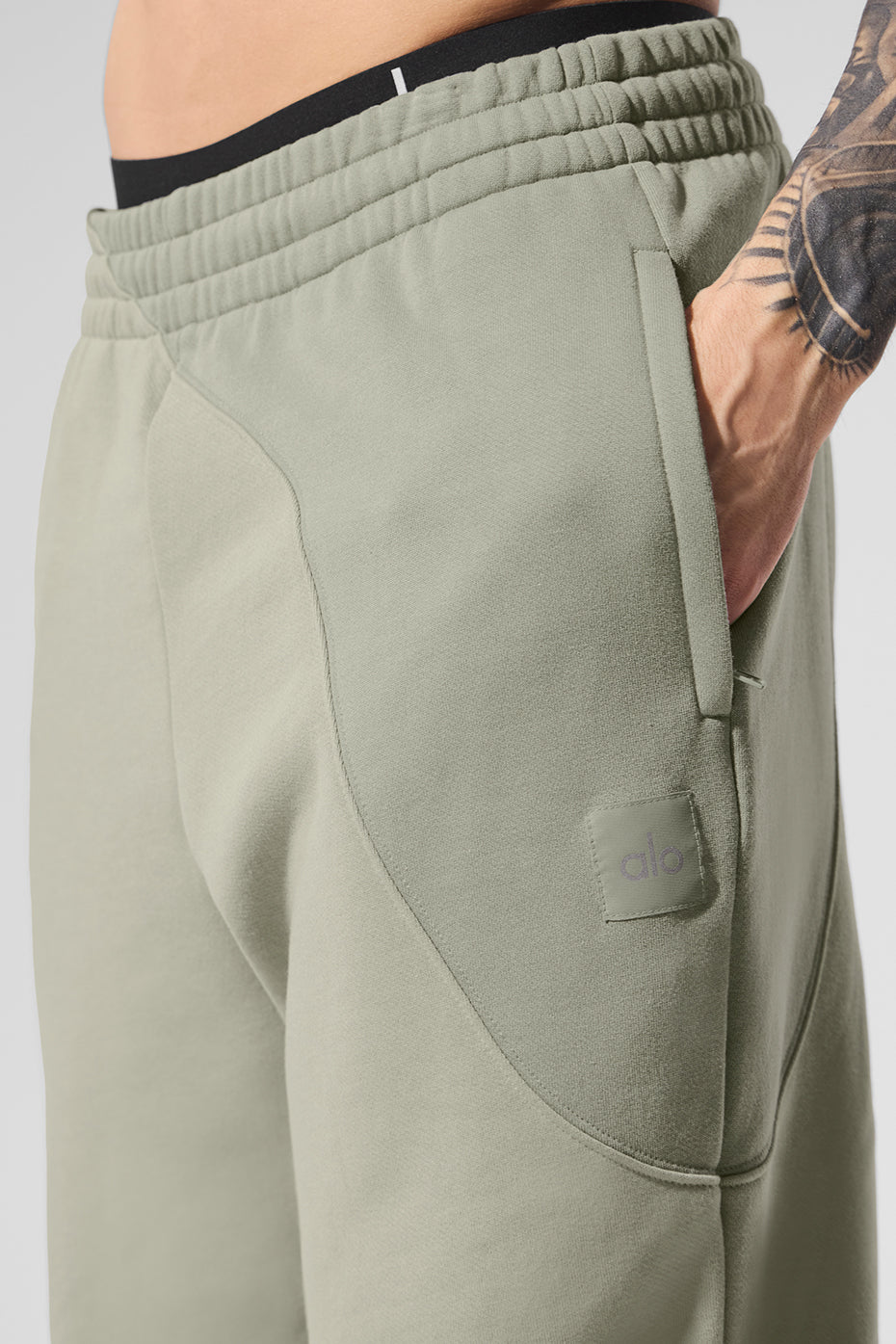 Front view of relaxed fit French terry sweatpants in limestone tone with elastic waistband