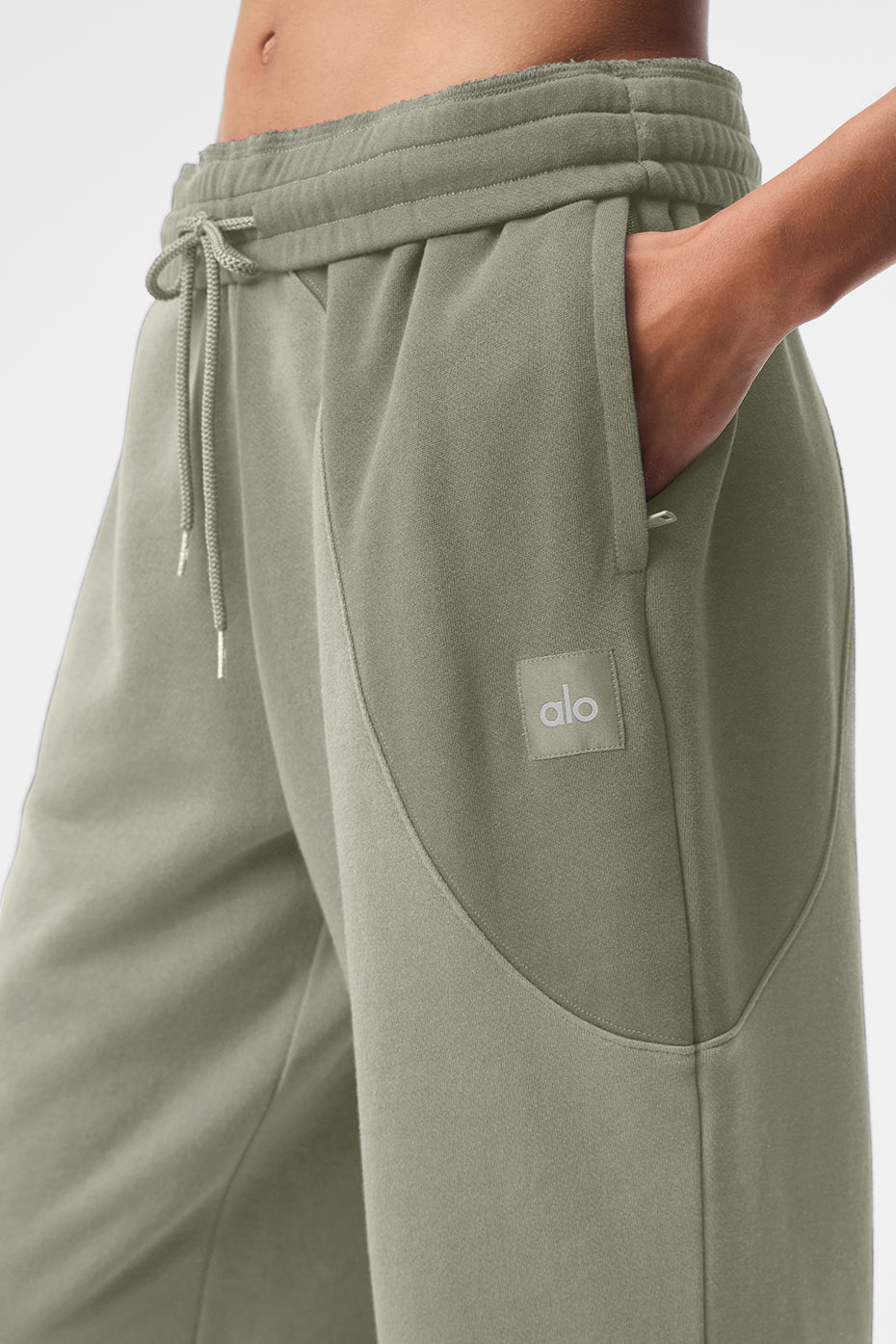 Full-body shot of sweatpants paired with a white t-shirt for streetwear style