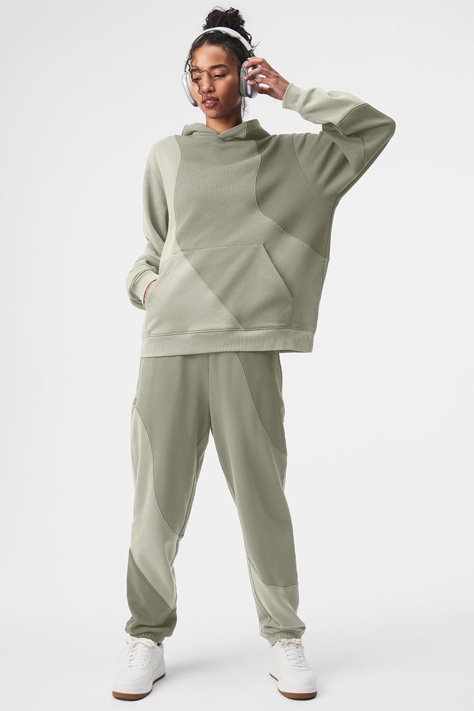 Close-up of wave-pattern stitching on grey sweatpants