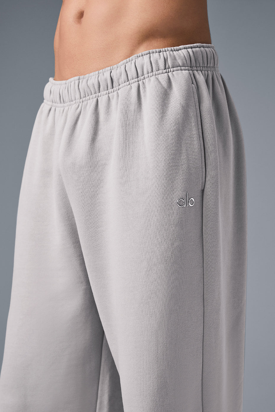 Front view of grey wide leg sweatpants highlighting the relaxed fit and washed finish