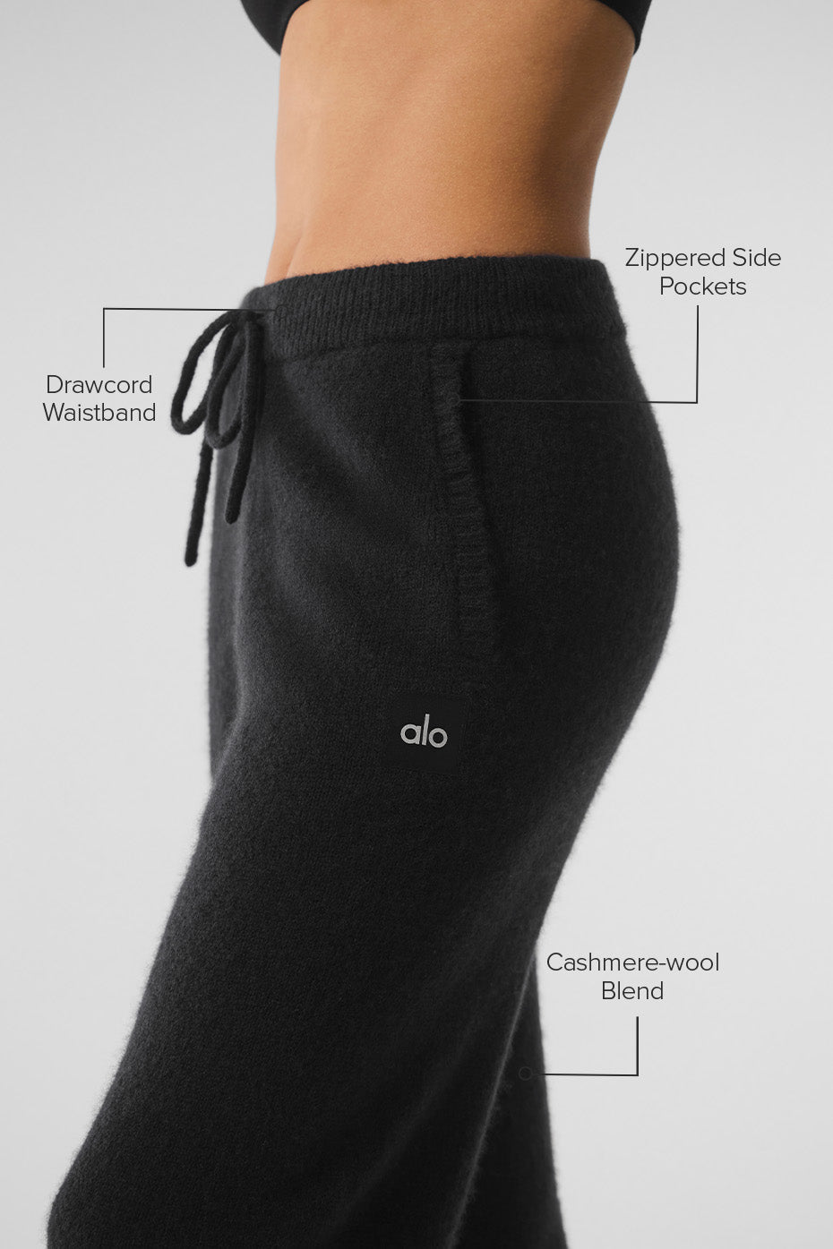 Cashmere pants women wear for errands or lounging, shown in a relaxed urban setting