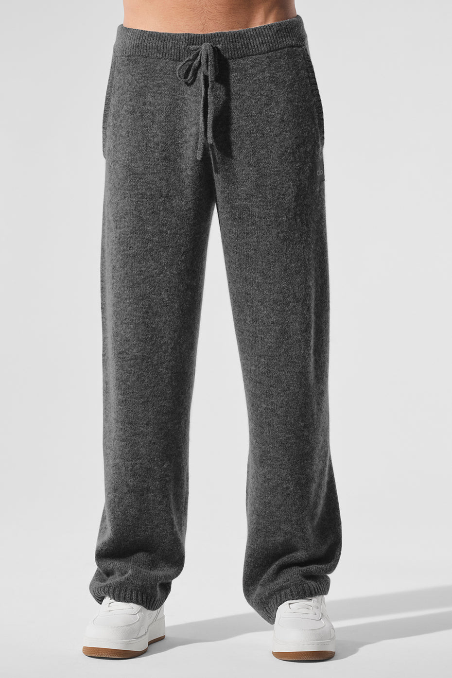 Front view of platinum grey cashmere lounge pants on a model.