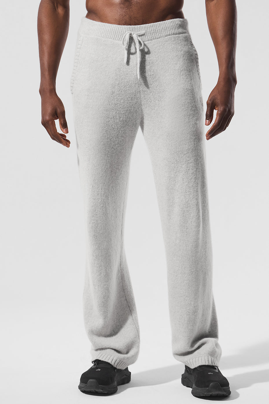 Pearl Grey Heather cashmere pants showcased in a cozy living room setting.
