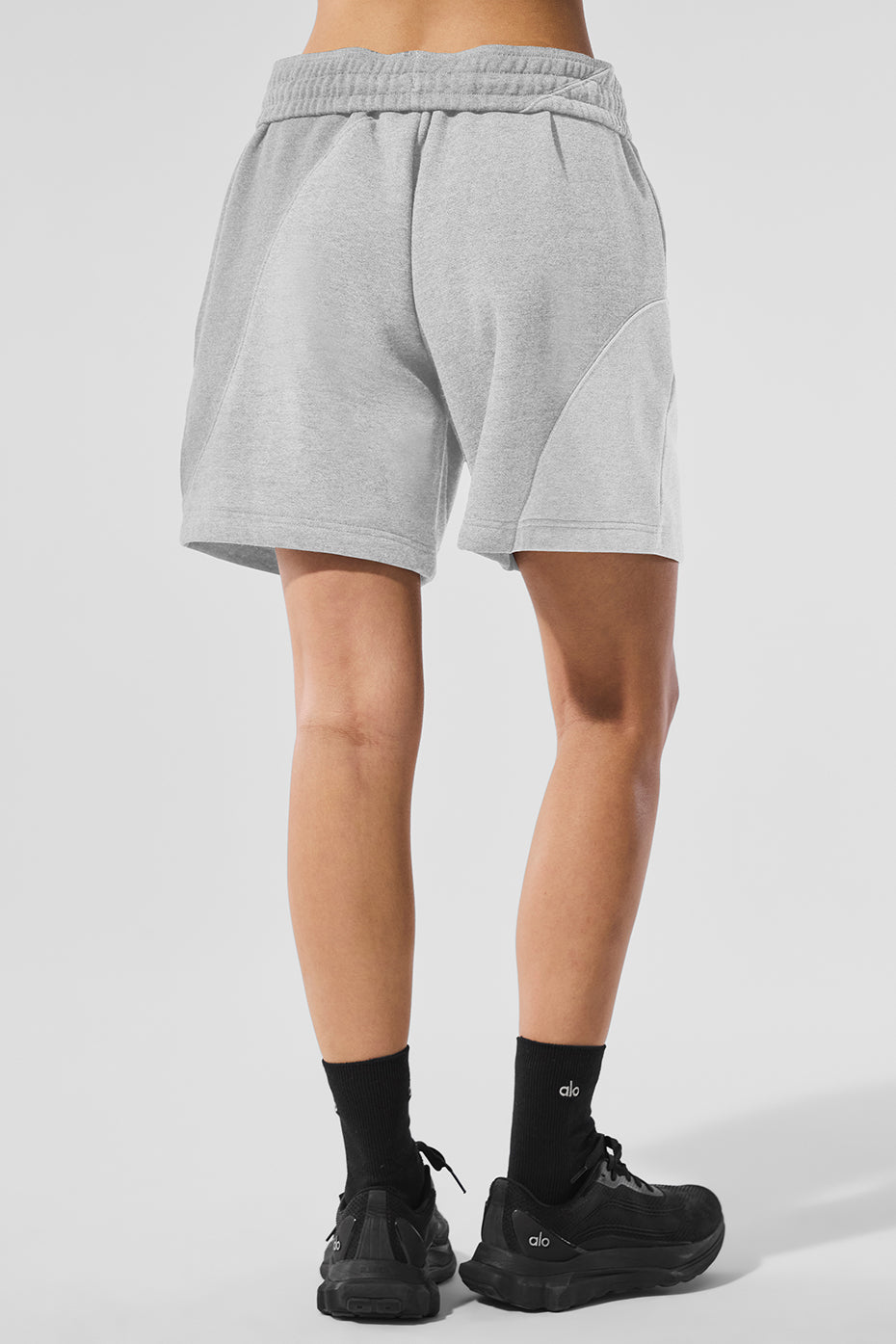 Side profile of shorts in motion, worn for light training or weekend errands