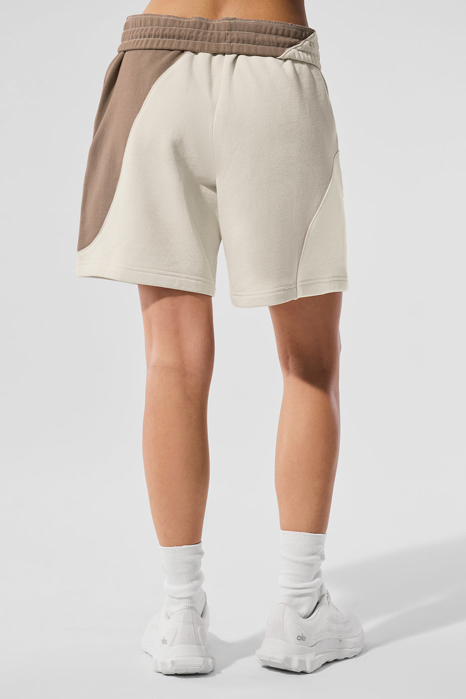 Closeup of wave seam design on ss activewear ivory shorts