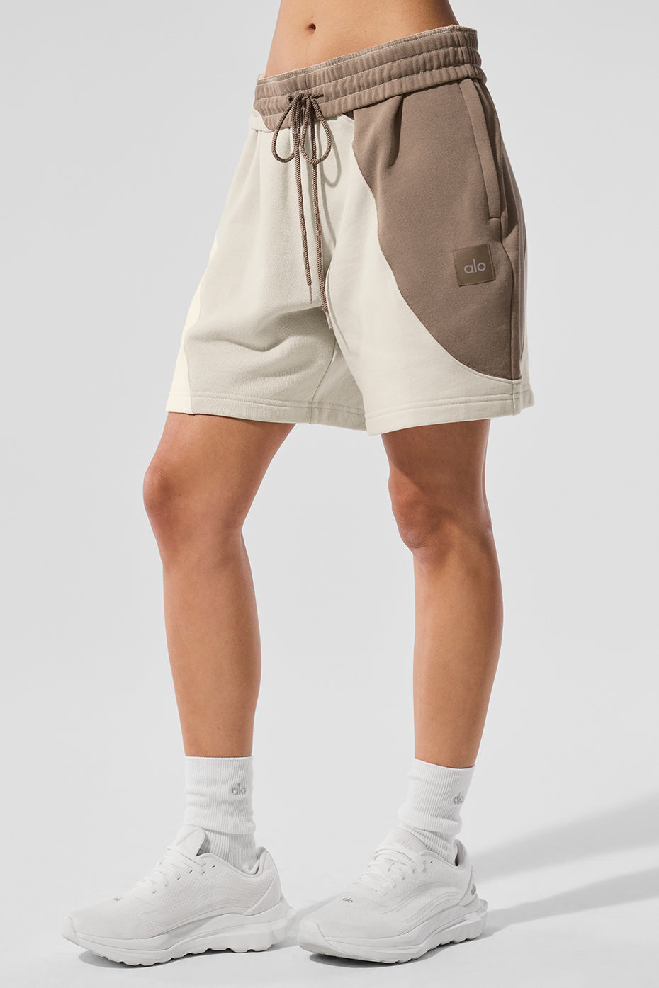Closeup of wave seam design on ss activewear ivory shorts