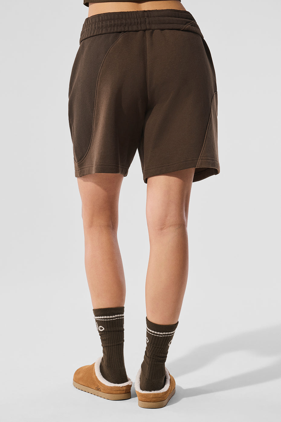 Model wearing 7" bike shorts during morning workout in park