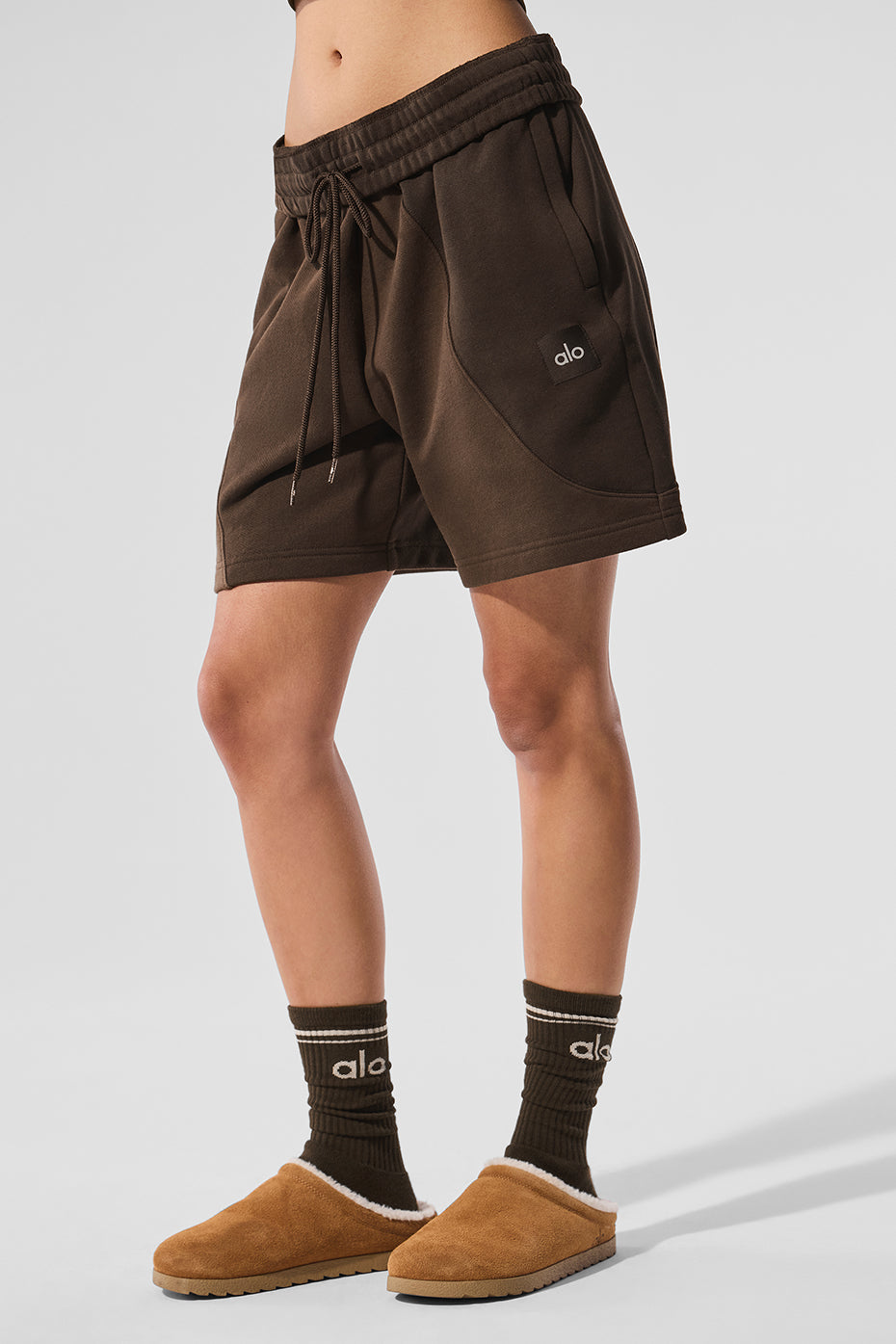 Espresso tonal athletic shorts folded with texture visible