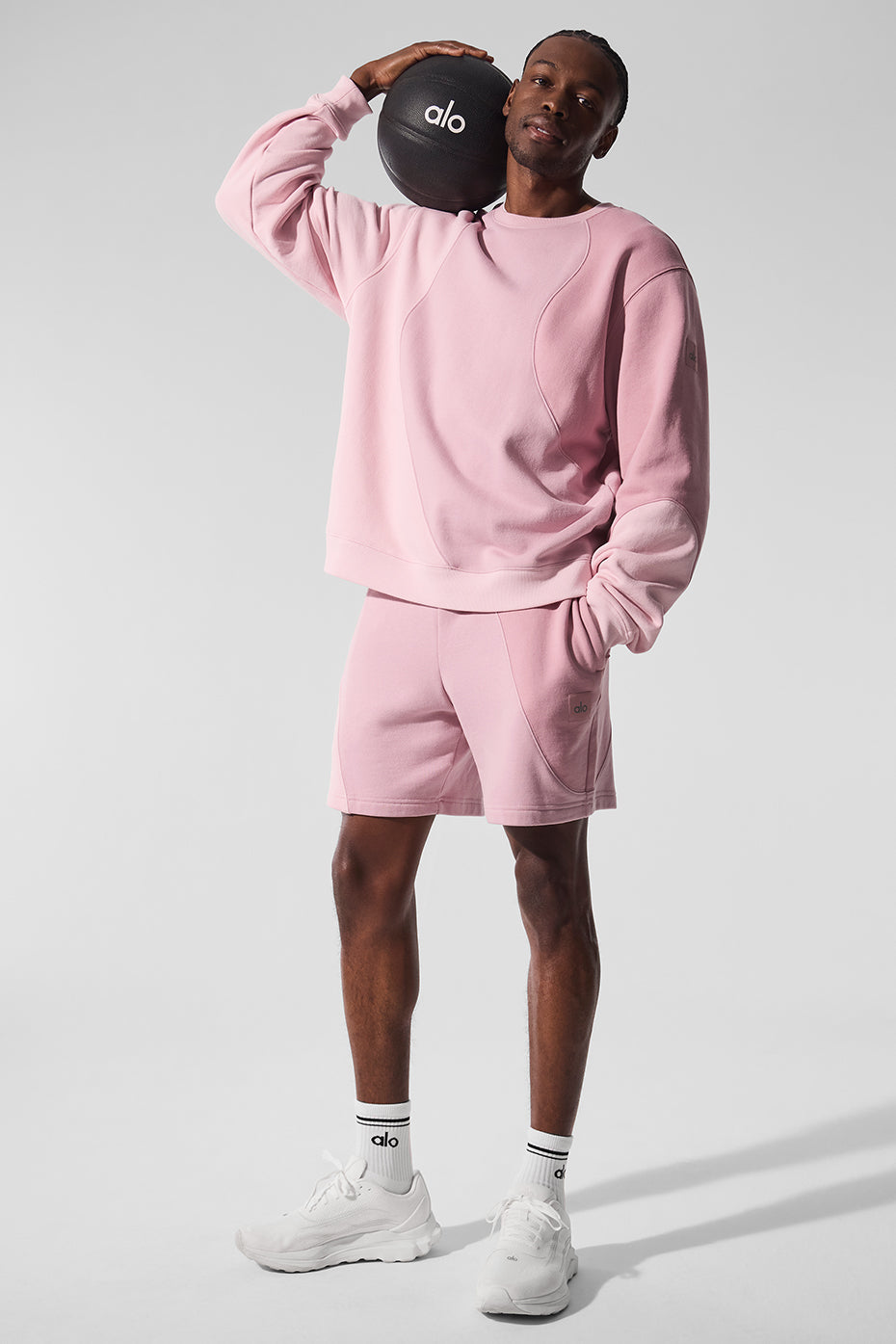 Side profile of light pink workout shorts, modeled on outdoor trail in Virginia