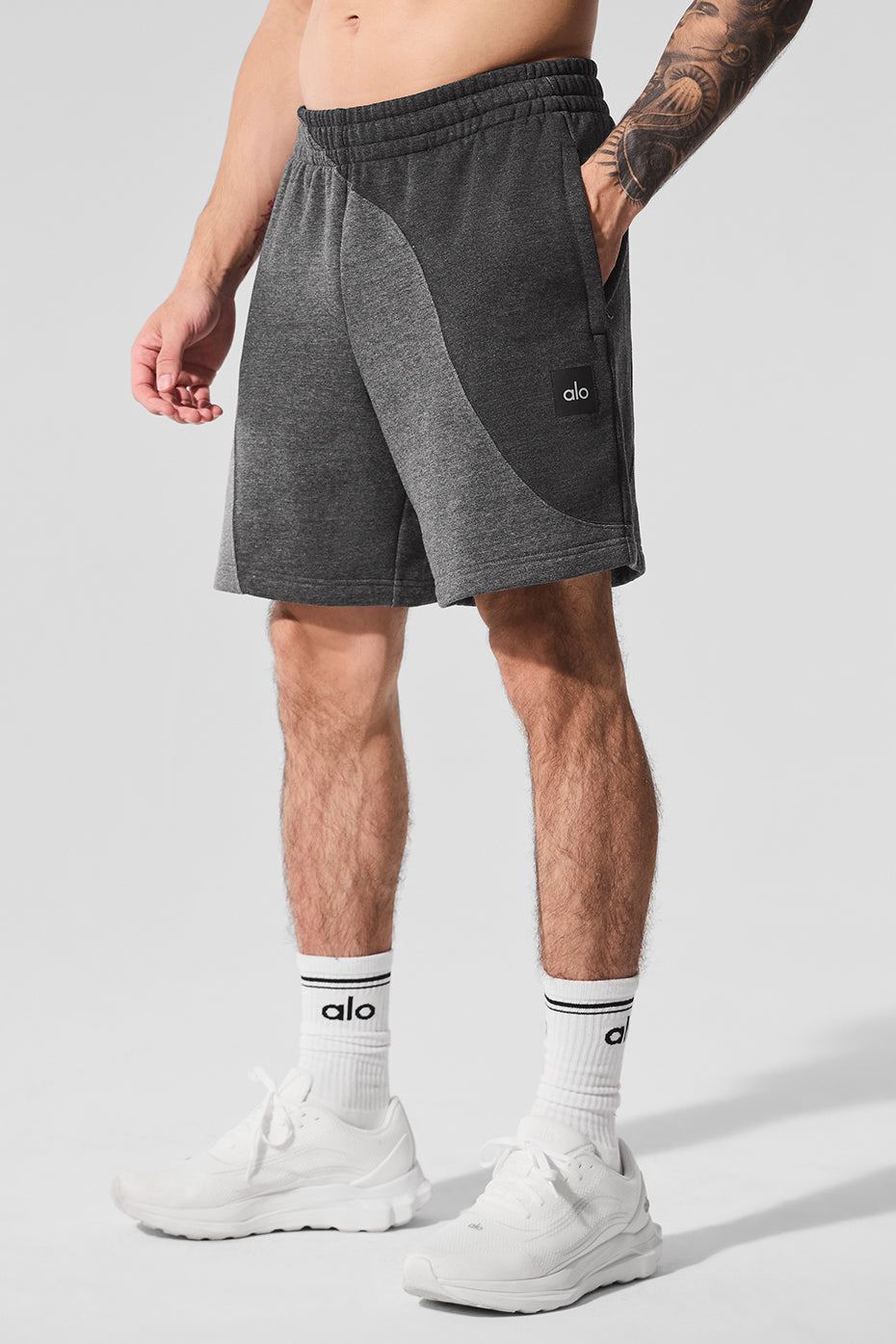 Front view of mens fleece shorts in dark heather grey, showcasing the wave pattern.