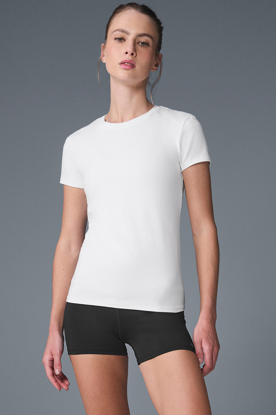Front view of the lightweight Alosoft yoga tee in white, ideal for yoga sessions.