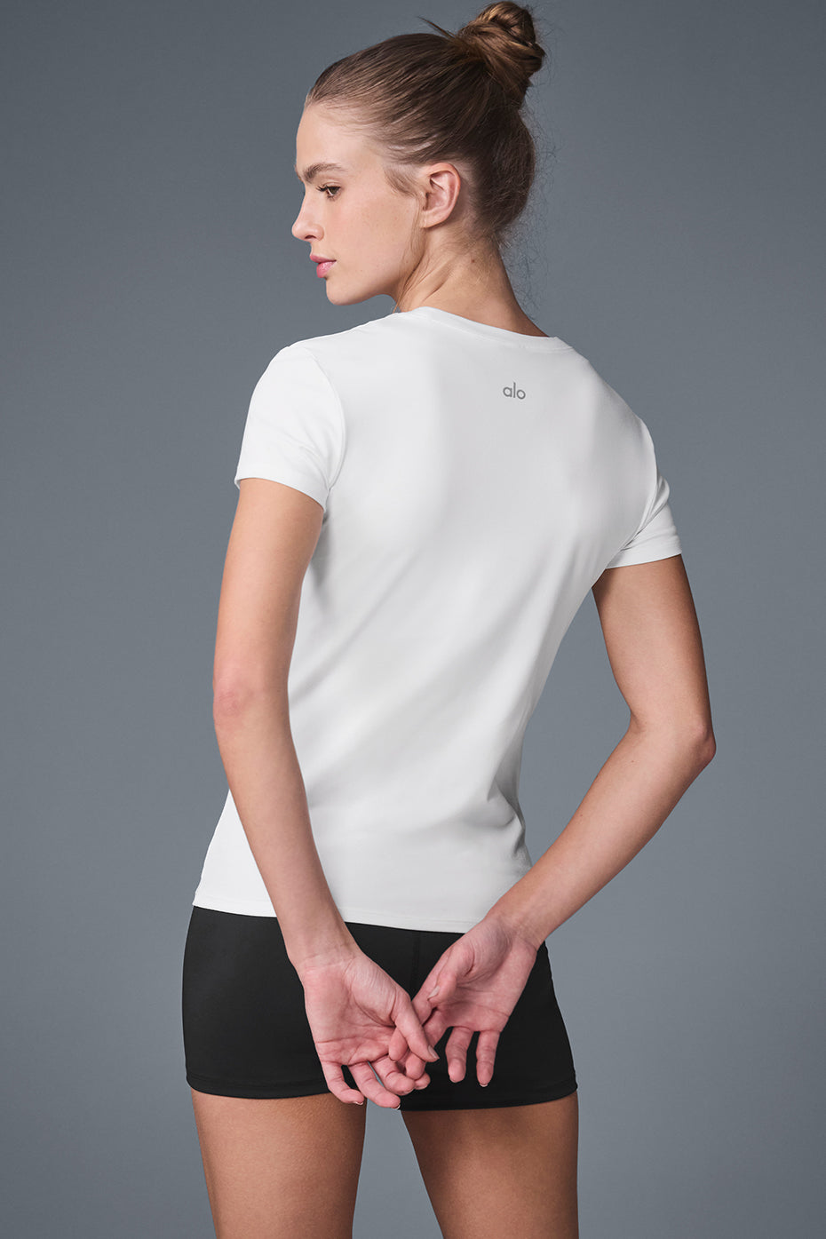 Side view showcasing the relaxed fit of the Alosoft Everyday Yoga Tee.