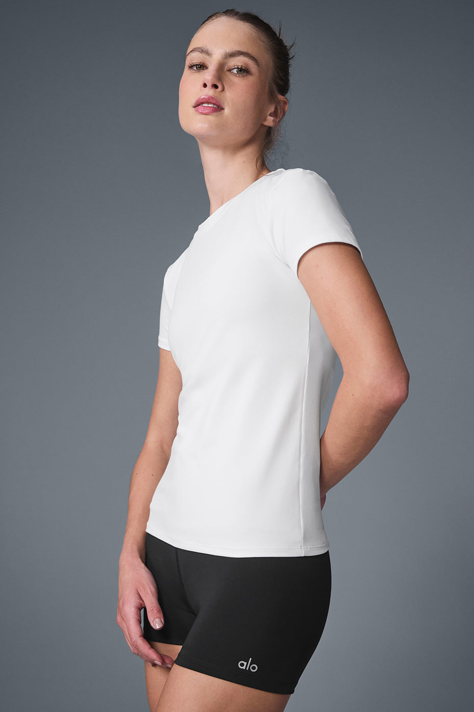 Front view of the lightweight Alosoft yoga tee in white, ideal for yoga sessions.