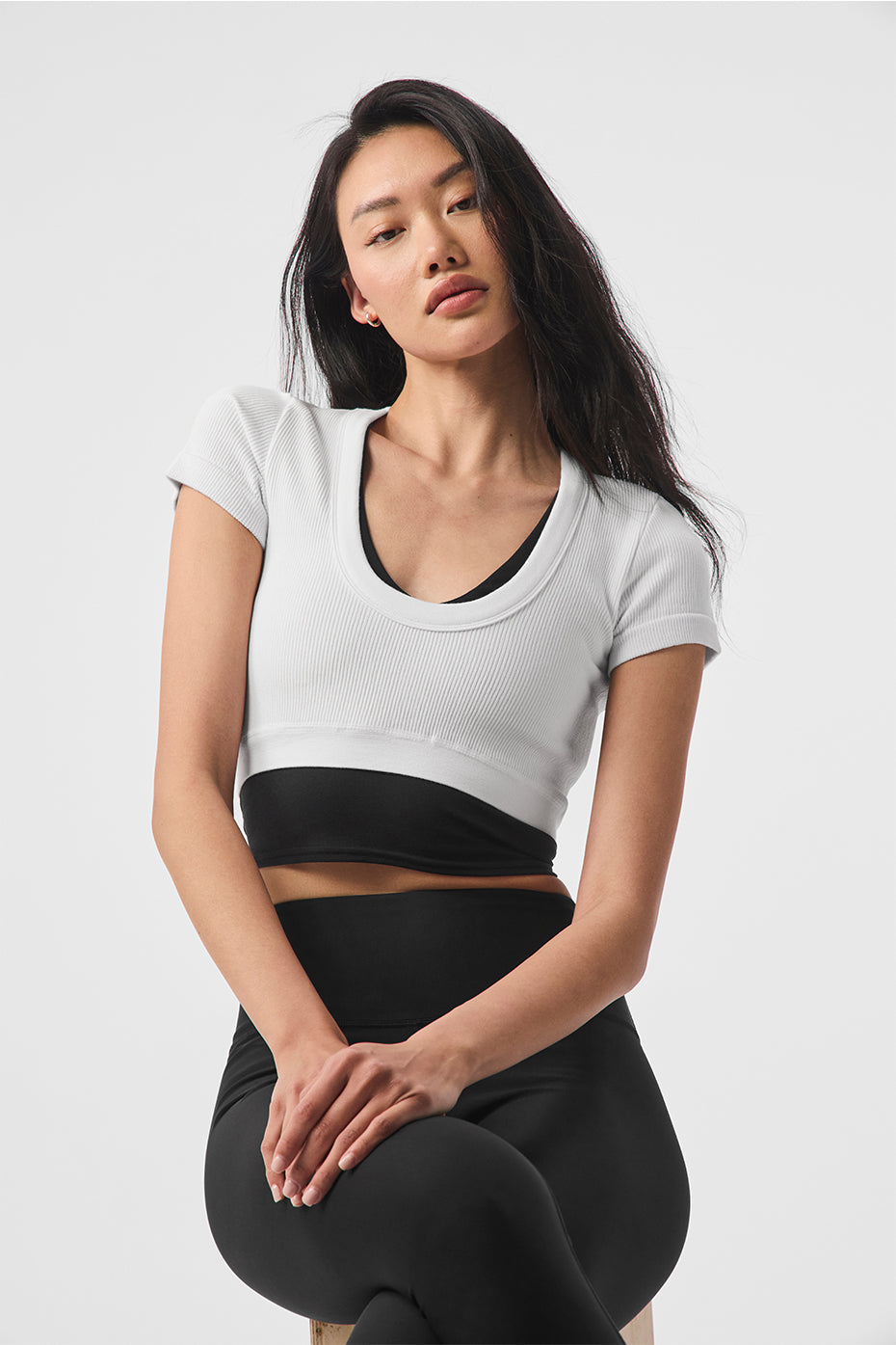Front view of the Serene Ribbed Crop Top in white, showcasing the ribbed texture and scoop neckline.
