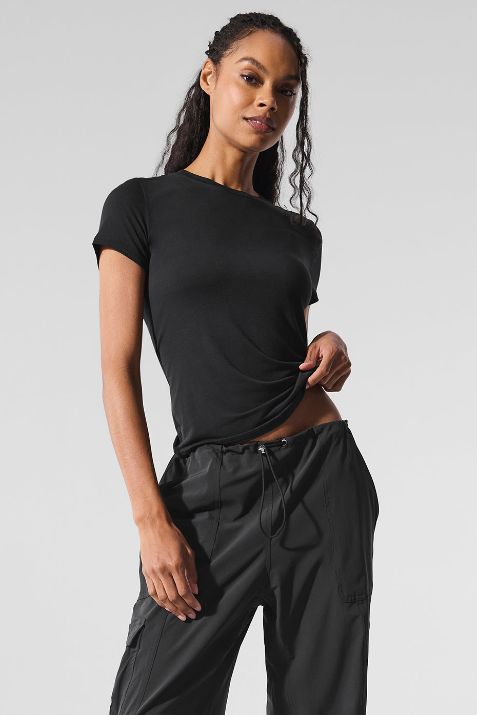 Front view of woman wearing short sleeve black t shirt women prefer for daily wear