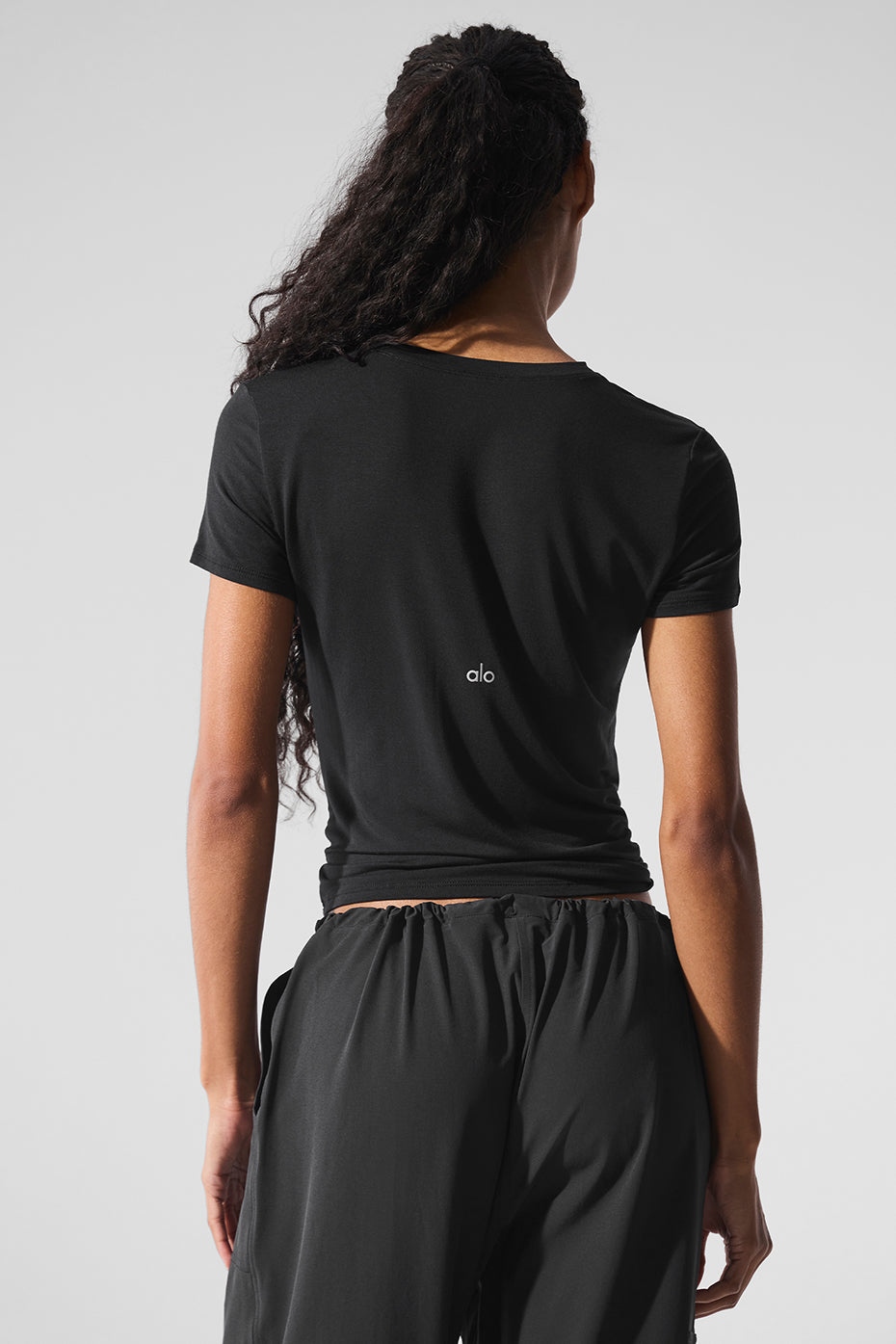 Side angle of super soft modal t-shirt paired with relaxed trousers
