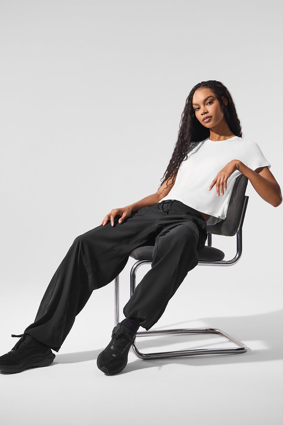 Model styling the cropped t-shirt with casual bottoms for everyday wear